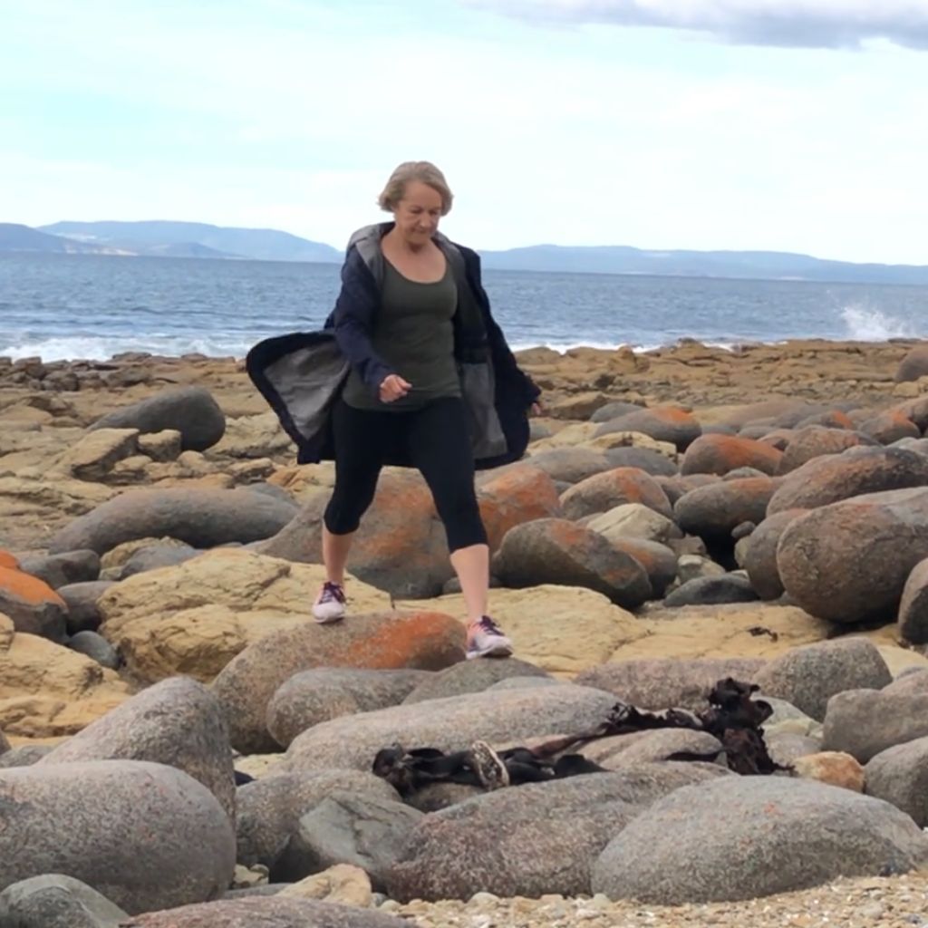 lunging over rocks