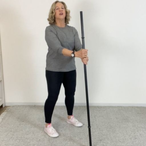 broom assisted squat 1
