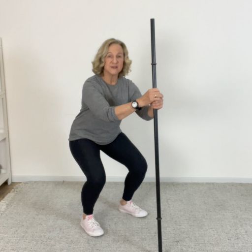 broom assisted squat 3