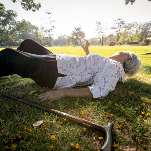 older woman fallen over needing to roll over to get up