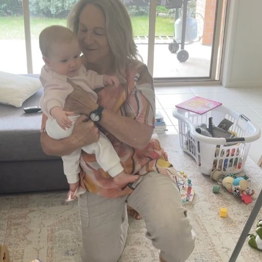 sheree standing up with grandchild